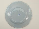 a blue plate with a blue flower on it
