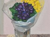 purple and yellow flowers in a vase on a doily tablecloth