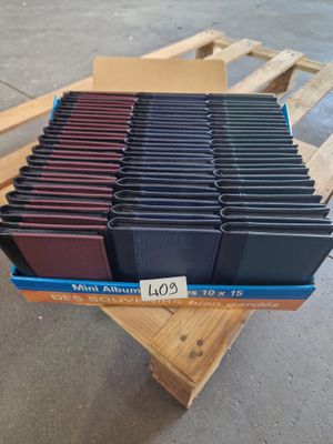 a stack of books sitting on top of a pallet on top of a wooden pallet