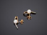 a pair of pearl and gold earrings