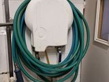 a hose and a spray bottle on a table in a room