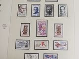 a picture of a collection of stamps on a sheet of paper