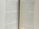an open book on a table with a white background