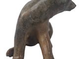 bronze statue of a bear sitting on its hind legs