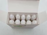 a box with a dozen of empty bottles in it