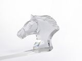 crystal figurine of a horse head on a white background