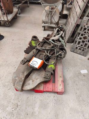 a pile of tools on a pallet in a warehouse