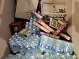 a cardboard box full of water bottles and other items