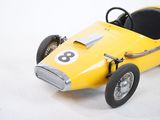 a yellow toy car with a number eight on it
