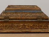 a small wooden box with a lid on a table