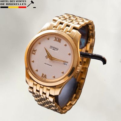 a gold wrist watch with a white dial on a gold bracelet
