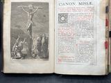an old book with a picture of a crucif on it