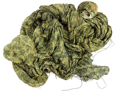 a pile of green yarn on a white surface