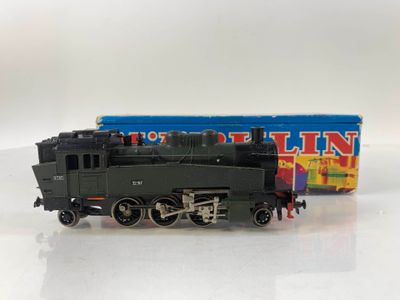 a toy train that is sitting next to a box