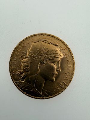 an image of a gold coin with a woman ' s face on it