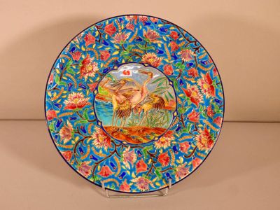 a colorful plate with a picture of a man and a dog on it