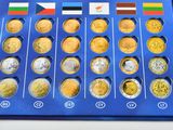 a blue box with a lot of different coins in it