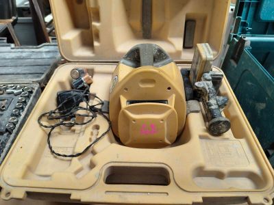 a yellow tool case with tools in it on a table