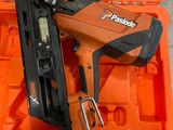 an orange box with a stapler, stapler, and other tools in it