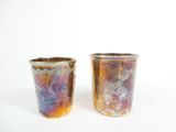 two cups that are next to each other on a table