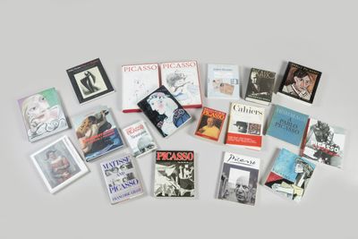 a lot of books that are on the table