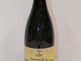 a bottle of wine that is sitting on a table