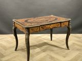 an image of a small table on a parquet floor