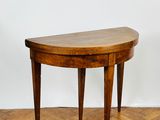an image of a small wooden table on a parquet floor