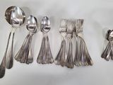 a lot of spoons and spoon spoons on the table