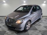 a picture of a silver mercedes b - class parked in a garage