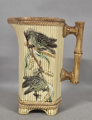 two birds sitting on a branch on this coffee mug