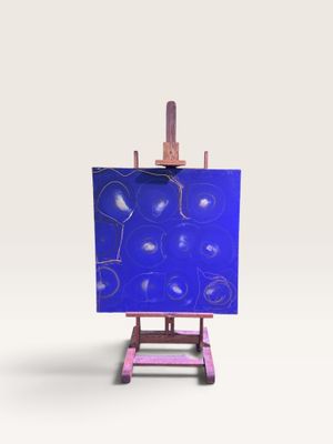 un petit chevalet sur lequel est posé un tableau bleu