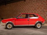 a red car that is parked in a garage