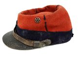 an orange and blue hat with a metal buckle on a white background