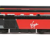 three model trains sitting side by side on a white surface