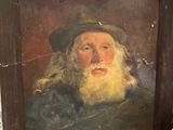 un tableau représentant un homme à la longue barbe et coiffé d'un chapeau