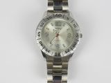 an image of a close up of a wrist watch on a white surface