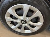 the tire of a car with a flat tire on the ground