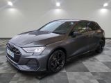 a grey audi rs3 is parked in a large room
