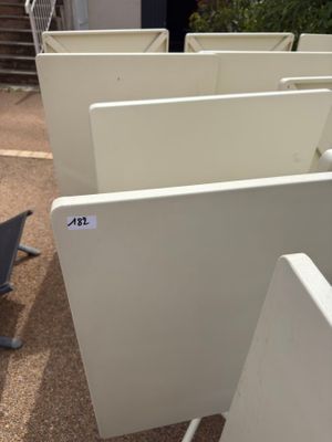 many computer screens sitting in a row on the ground