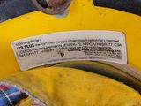 a close up of a yellow fire hydrant with a label on it