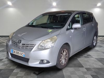 a silver car that is parked in a room