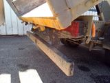 a dump truck that is sitting in the street