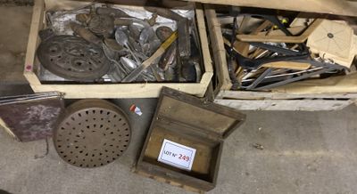 a box full of assorted tools sitting on the floor