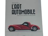 an image of a book with a picture of a red sports car