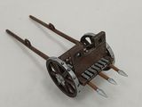 a small toy car with a long handle on a white surface