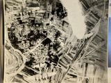 an old black and white photo of a city with lots of buildings