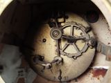 a close up of an old clock with rust on it