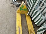 two skis that are laying on the ground next to a tent