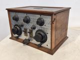 an old radio sitting on top of a table